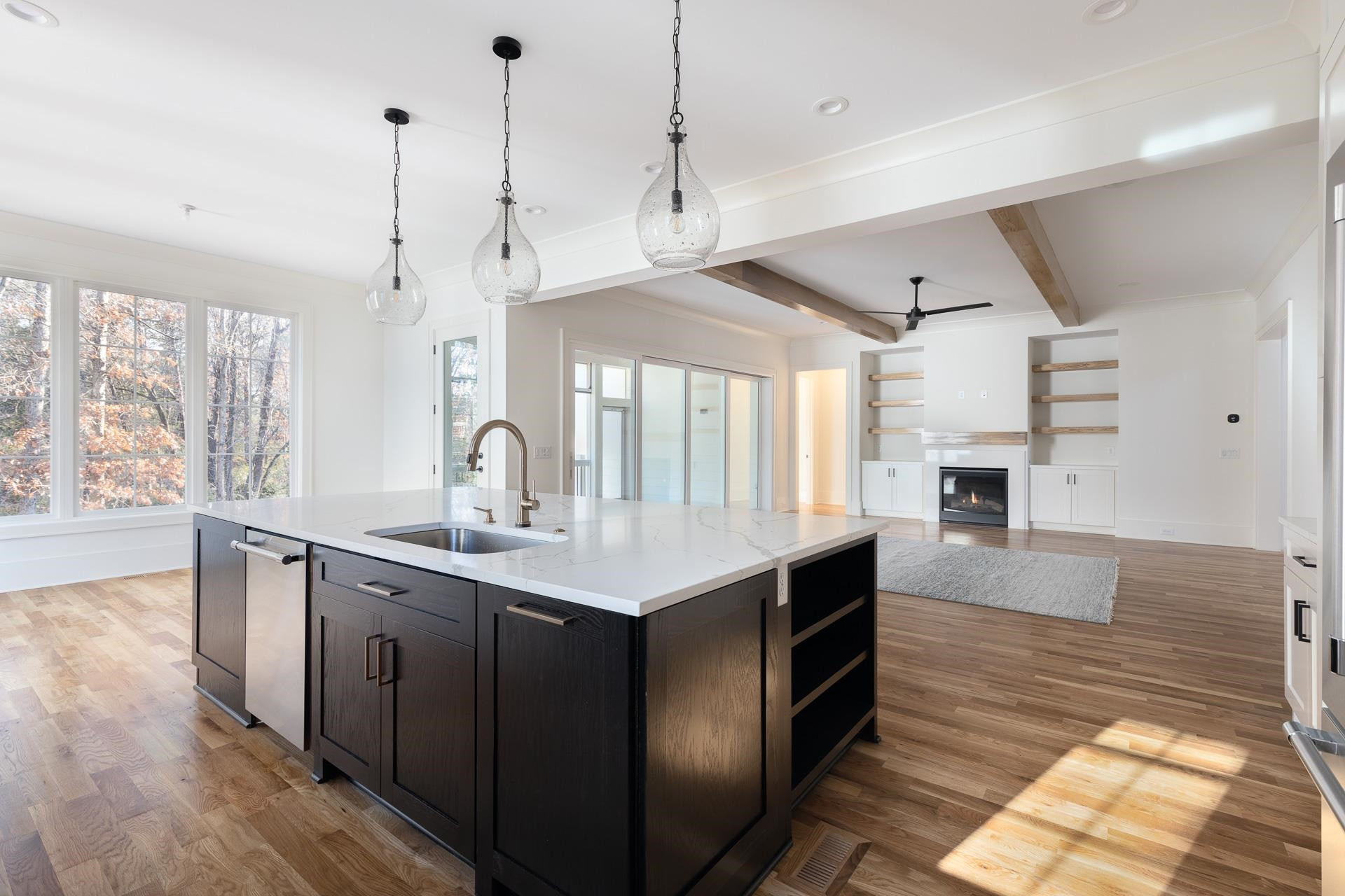 6312 Stephens Ridge Raleigh, NC 27615 - Photo 14 of 28 a kitchen with counter top space and wooden floor