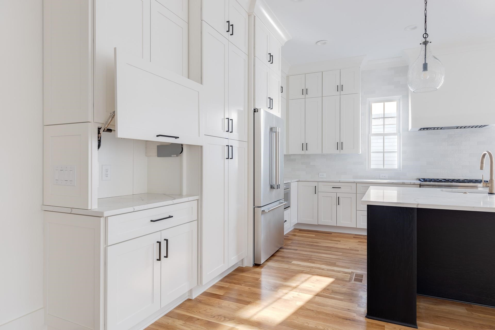 6312 Stephens Ridge Raleigh, NC 27615 - Photo 15 of 28 a view of a kitchen with white cabinets