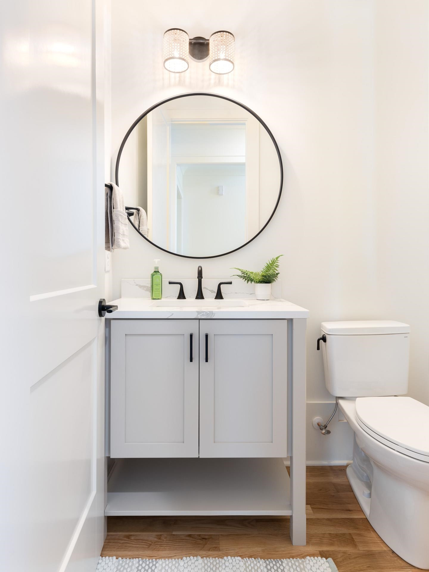 6312 Stephens Ridge Raleigh, NC 27615 - Photo 18 of 28 a bathroom with a sink a toilet and a mirror