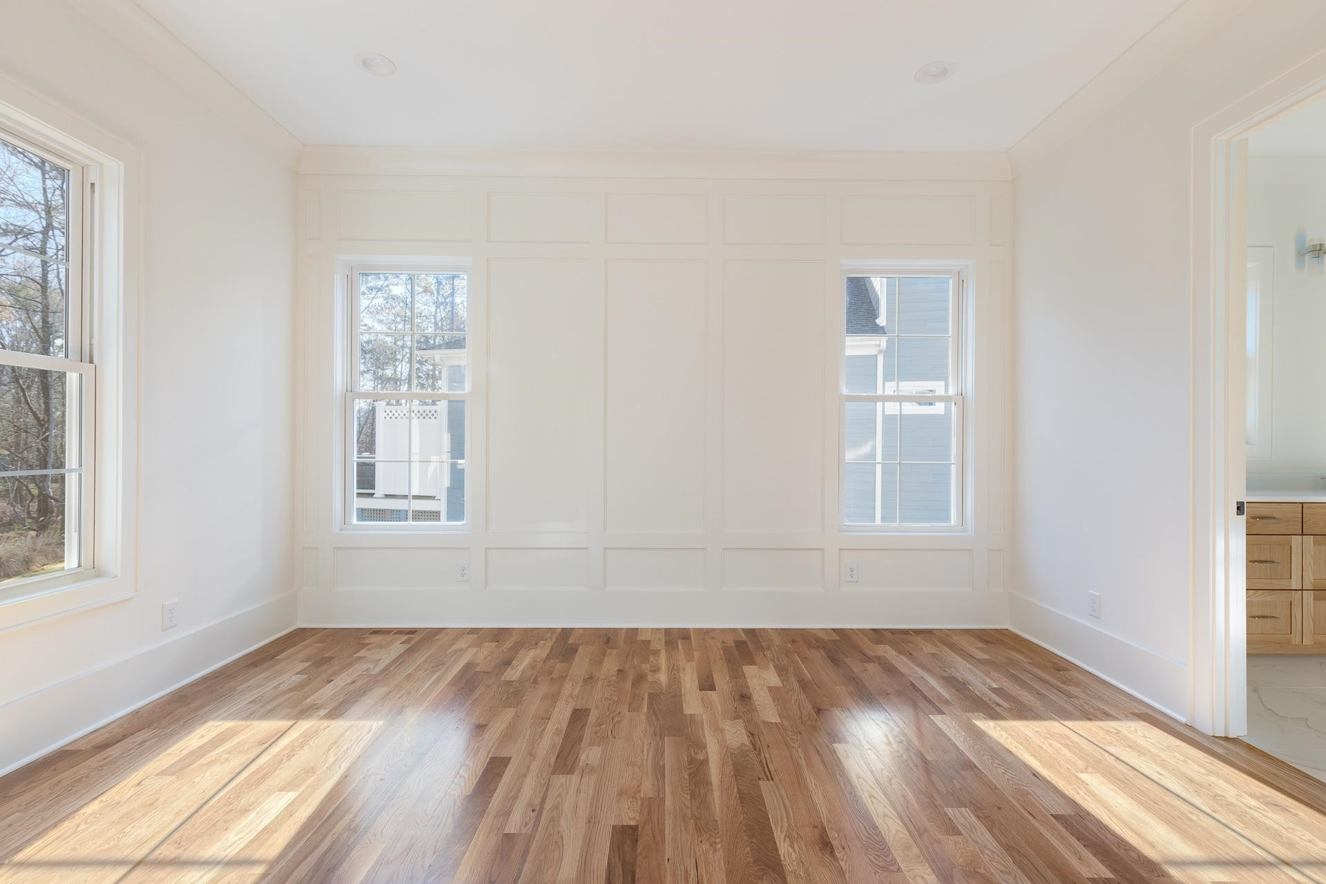 6312 Stephens Ridge Raleigh, NC 27615 - Photo 22 of 28 a view of empty room with wooden floor and fan