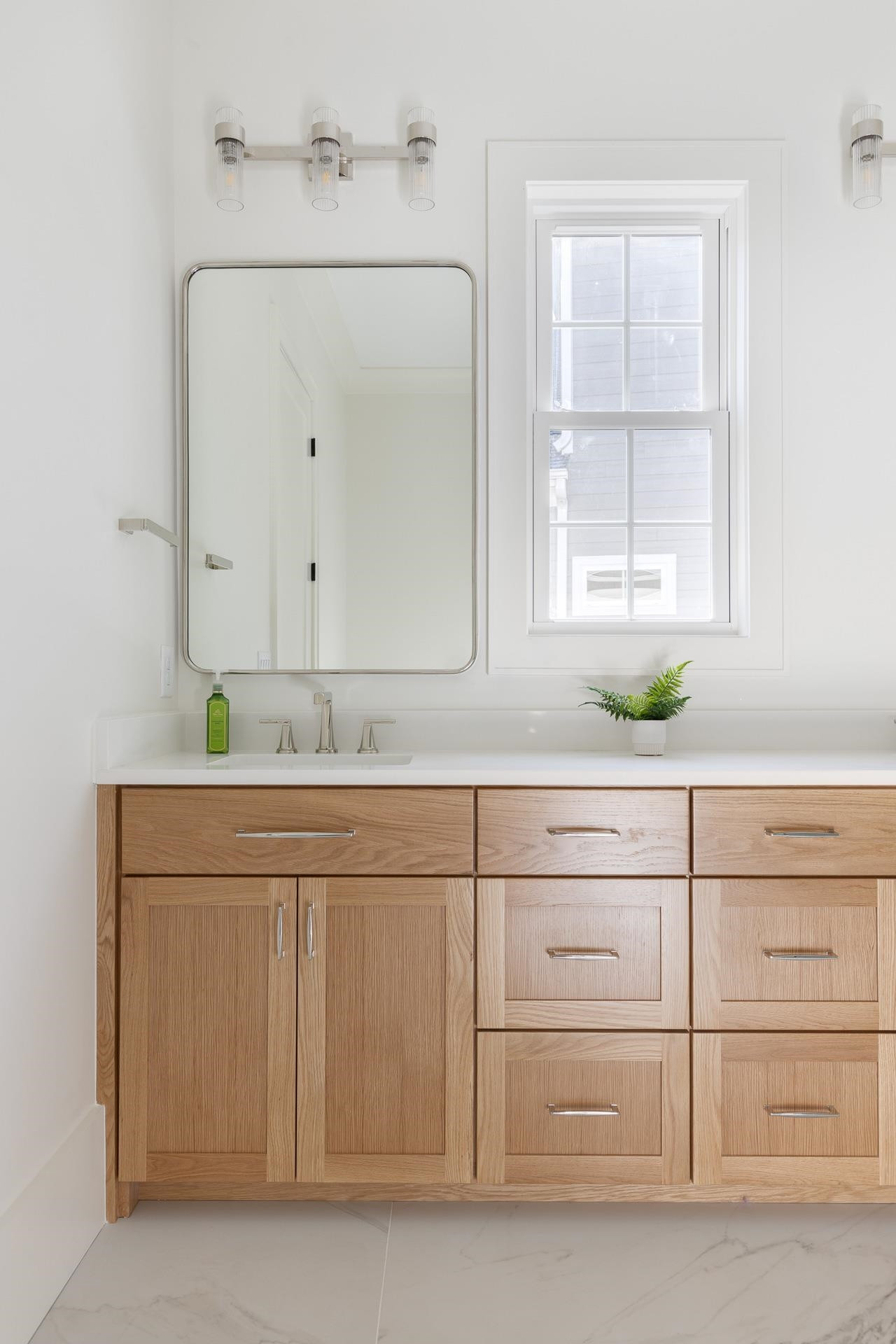 6312 Stephens Ridge Raleigh, NC 27615 - Photo 25 of 28 a sink with white cabinets