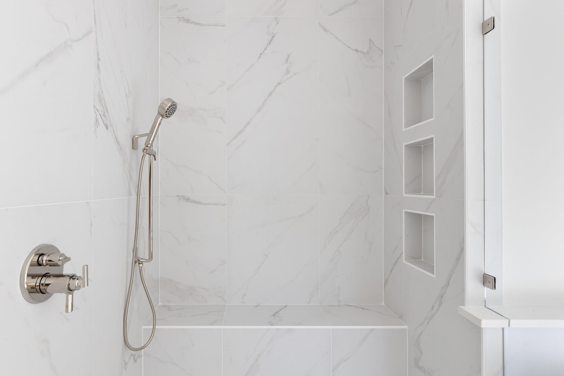 6312 Stephens Ridge Raleigh, NC 27615 - Photo 27 of 28 a bathroom with a glass shower door