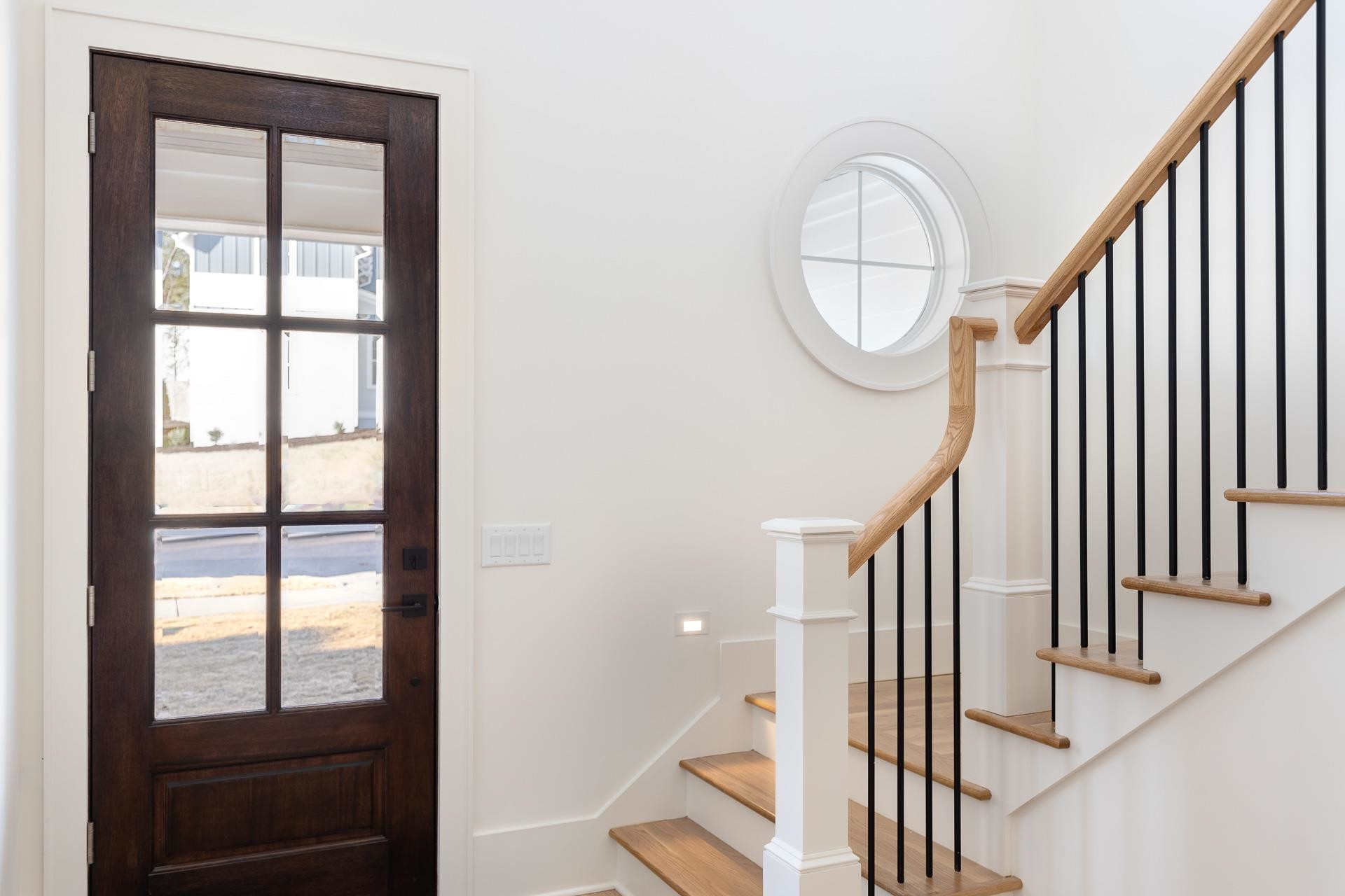6312 Stephens Ridge Raleigh, NC 27615 - Photo 4 of 28 a view of staircase with railing and a window