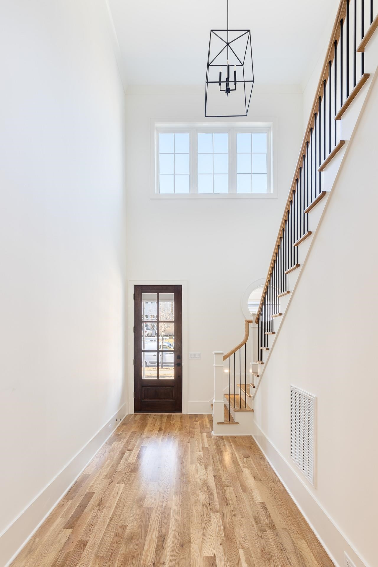 6312 Stephens Ridge Raleigh, NC 27615 - Photo 7 of 28 a view of entryway and hall with wooden floor