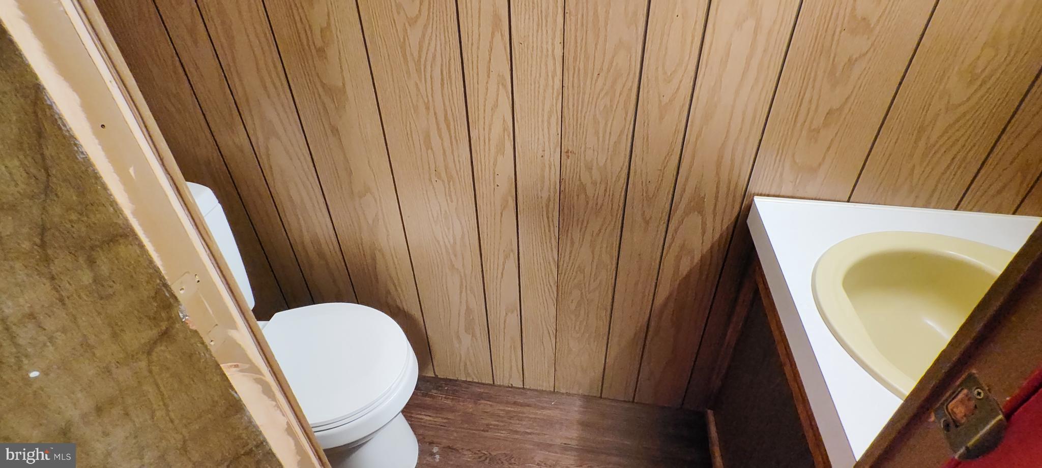 2633 Old Trail Road Liverpool, PA 17045 - Photo 17 of 32 a view of a bathroom with tub and wooden door