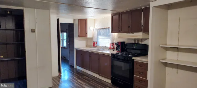 a kitchen with a refrigerator and a sink