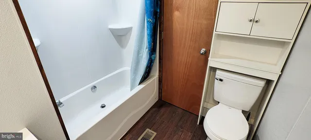 a bathroom with a toilet and a sink