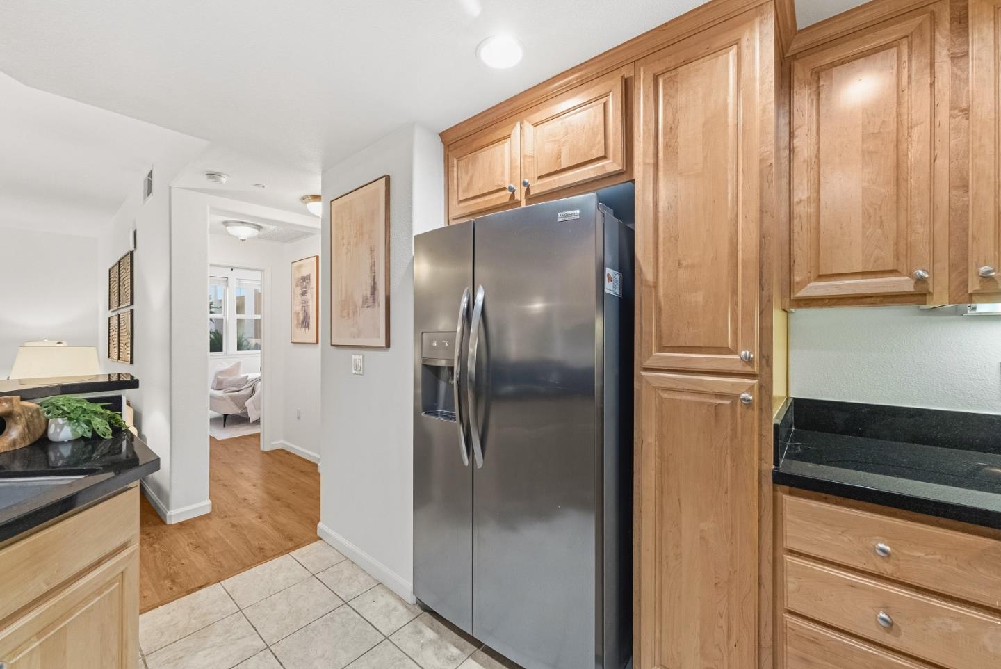 1390 Saddle Rack Street, Unit 223 San Jose, CA 95126 - Photo 11 of 36 a kitchen with stainless steel appliances granite countertop a refrigerator and a sink