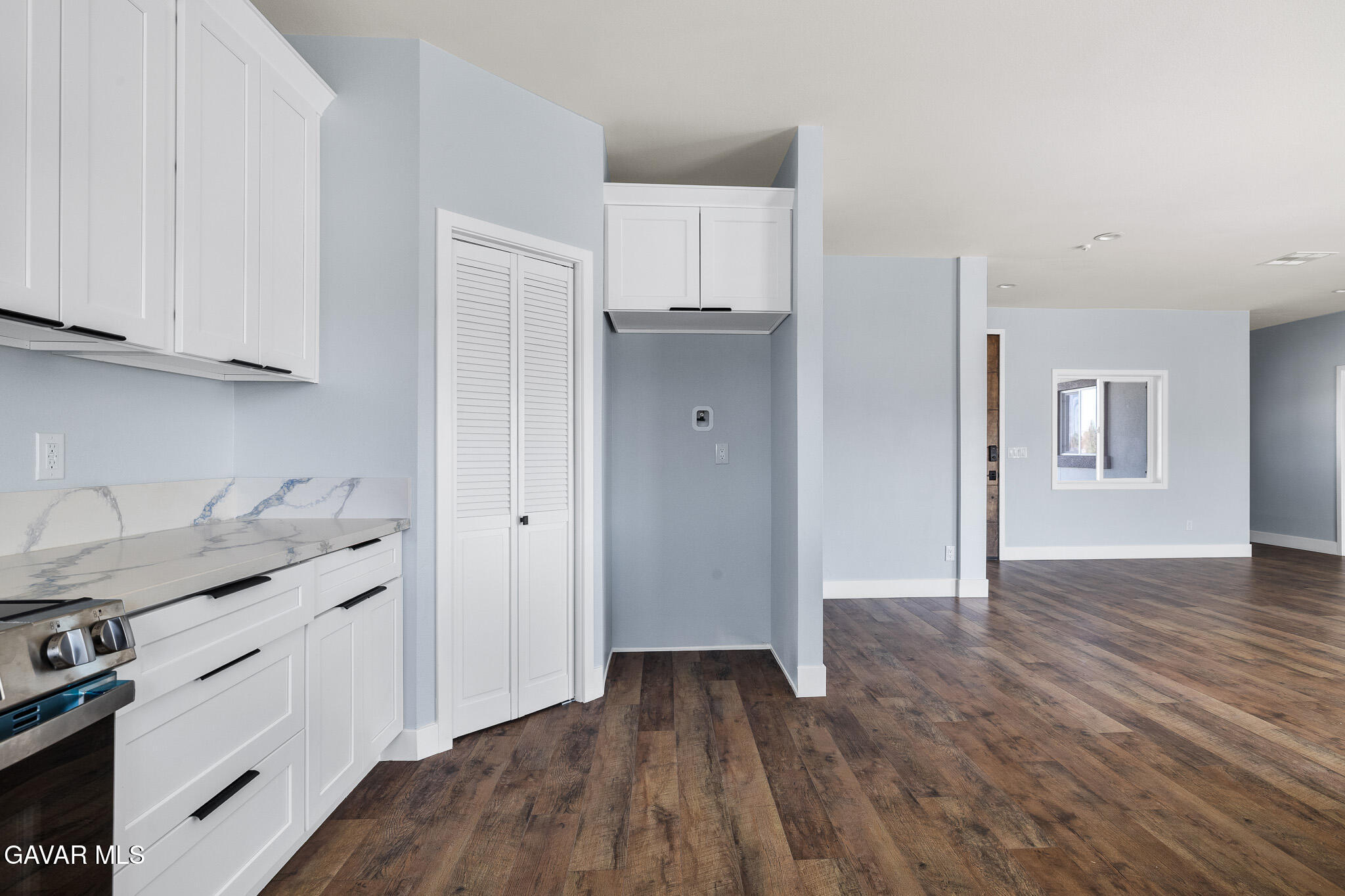10708 East Ave R 14 Littlerock, CA 93543 - Photo 12 of 38 a kitchen with a sink and cabinets