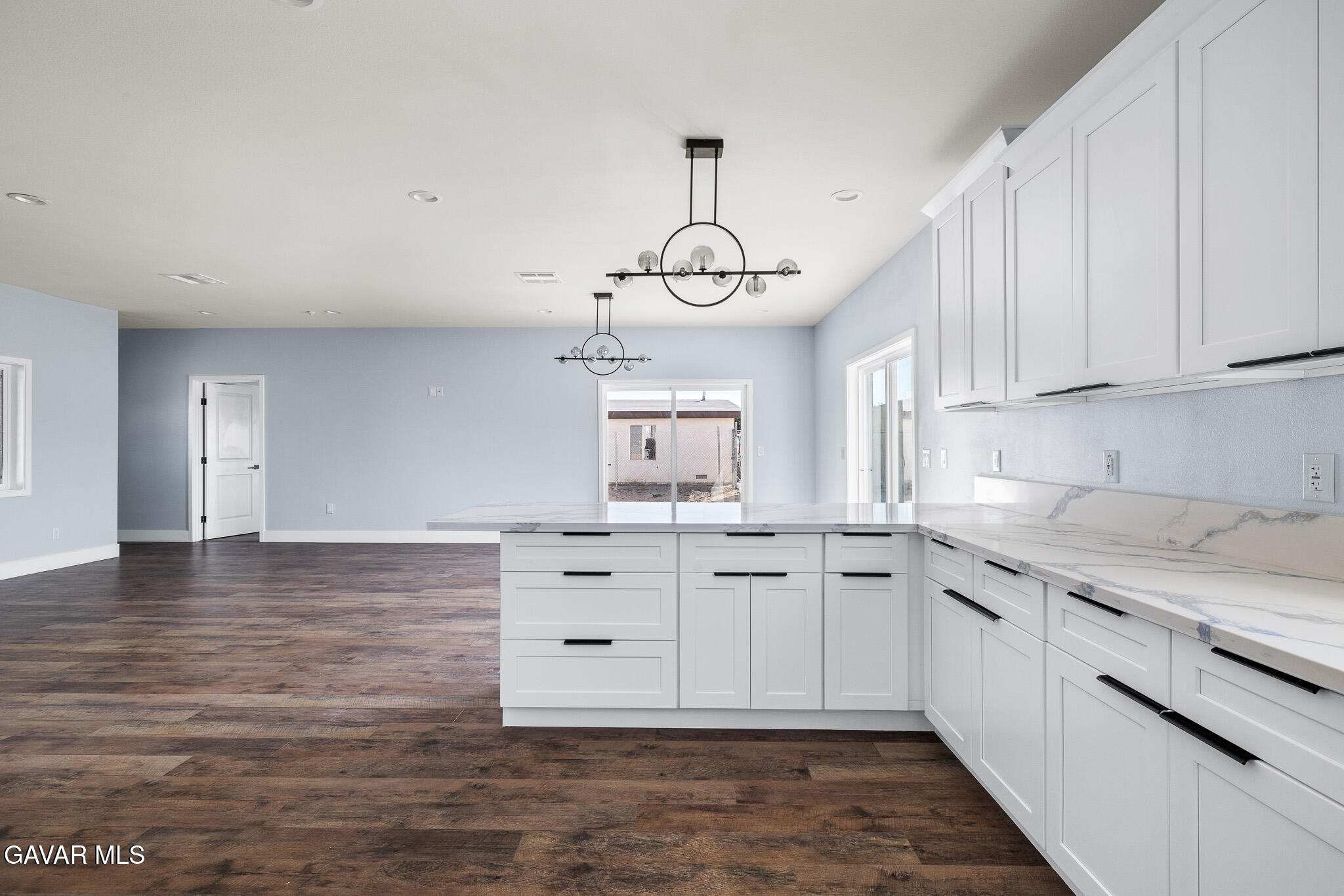 10708 East Ave R 14 Littlerock, CA 93543 - Photo 13 of 38 a kitchen with white cabinets and sink