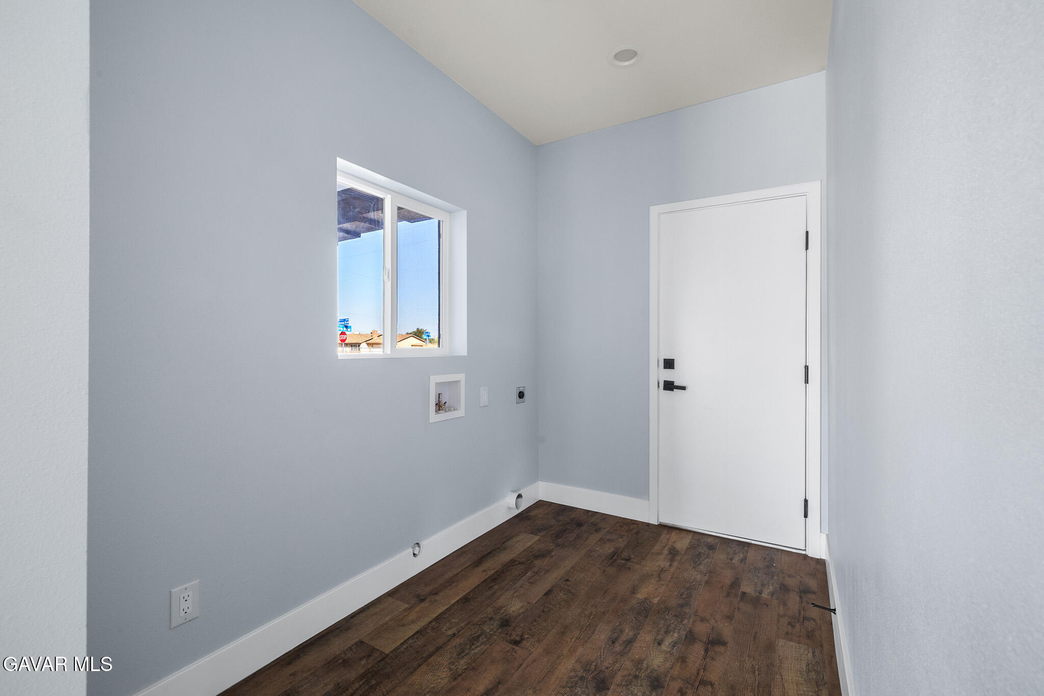 10708 East Ave R 14 Littlerock, CA 93543 - Photo 17 of 38 a view of an empty room with wooden floor and a window