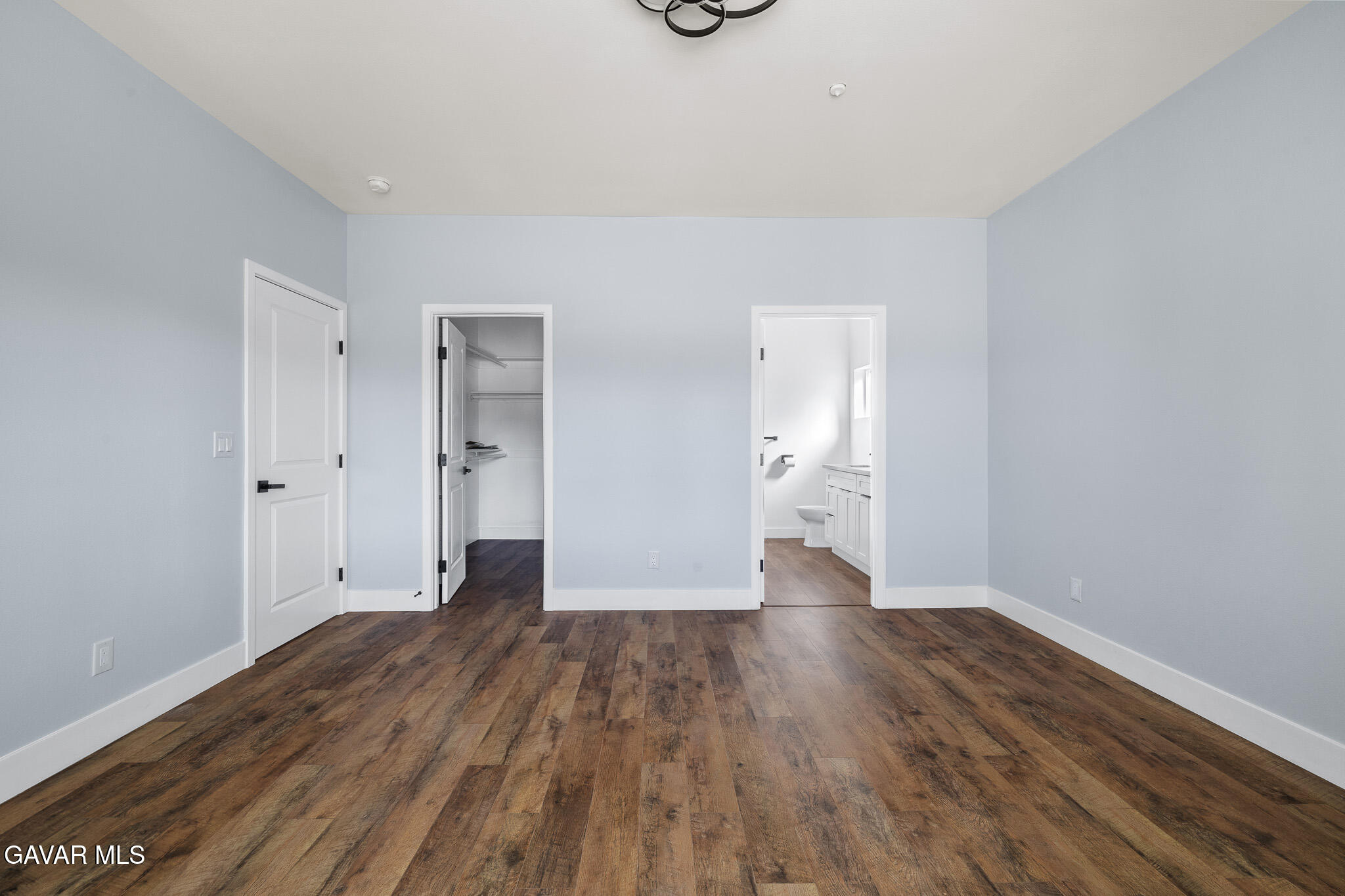 10708 East Ave R 14 Littlerock, CA 93543 - Photo 20 of 38 a view of an empty room with wooden floor and a window