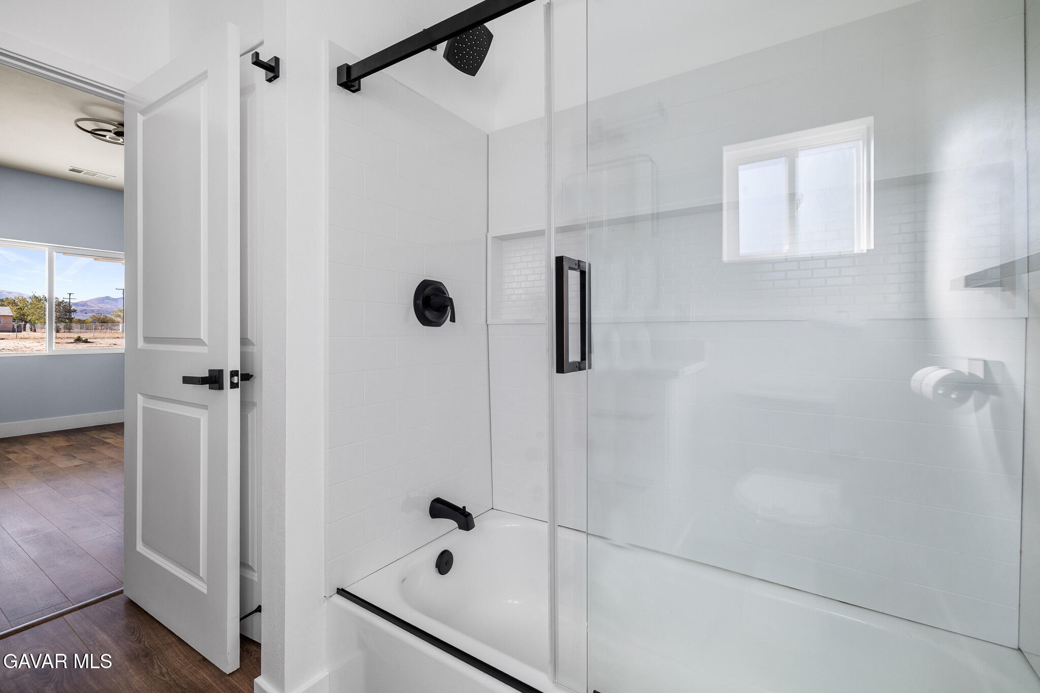10708 East Ave R 14 Littlerock, CA 93543 - Photo 22 of 38 a bathroom with a bathtub and a shower