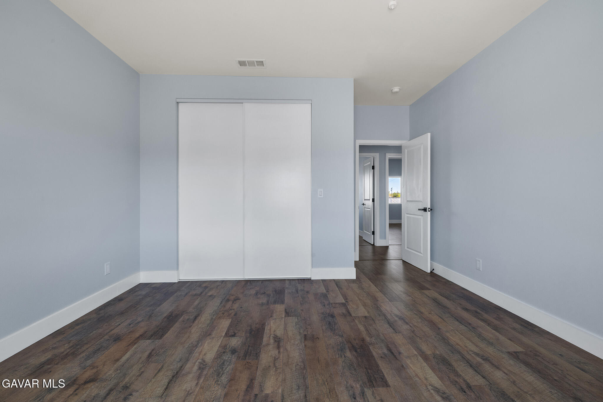 10708 East Ave R 14 Littlerock, CA 93543 - Photo 30 of 38 a view of an empty room and wooden floor