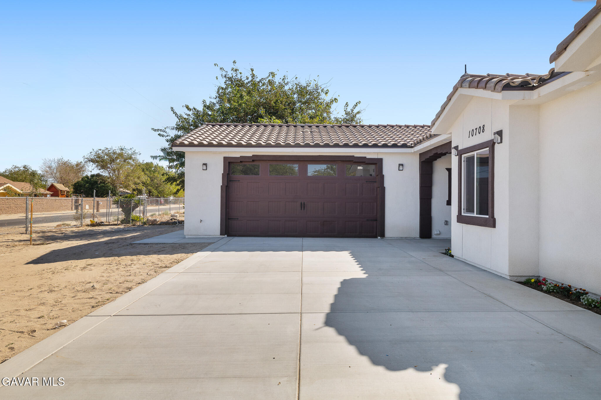 10708 East Ave R 14 Littlerock, CA 93543 - Photo 4 of 38 a front view of a house with a garage