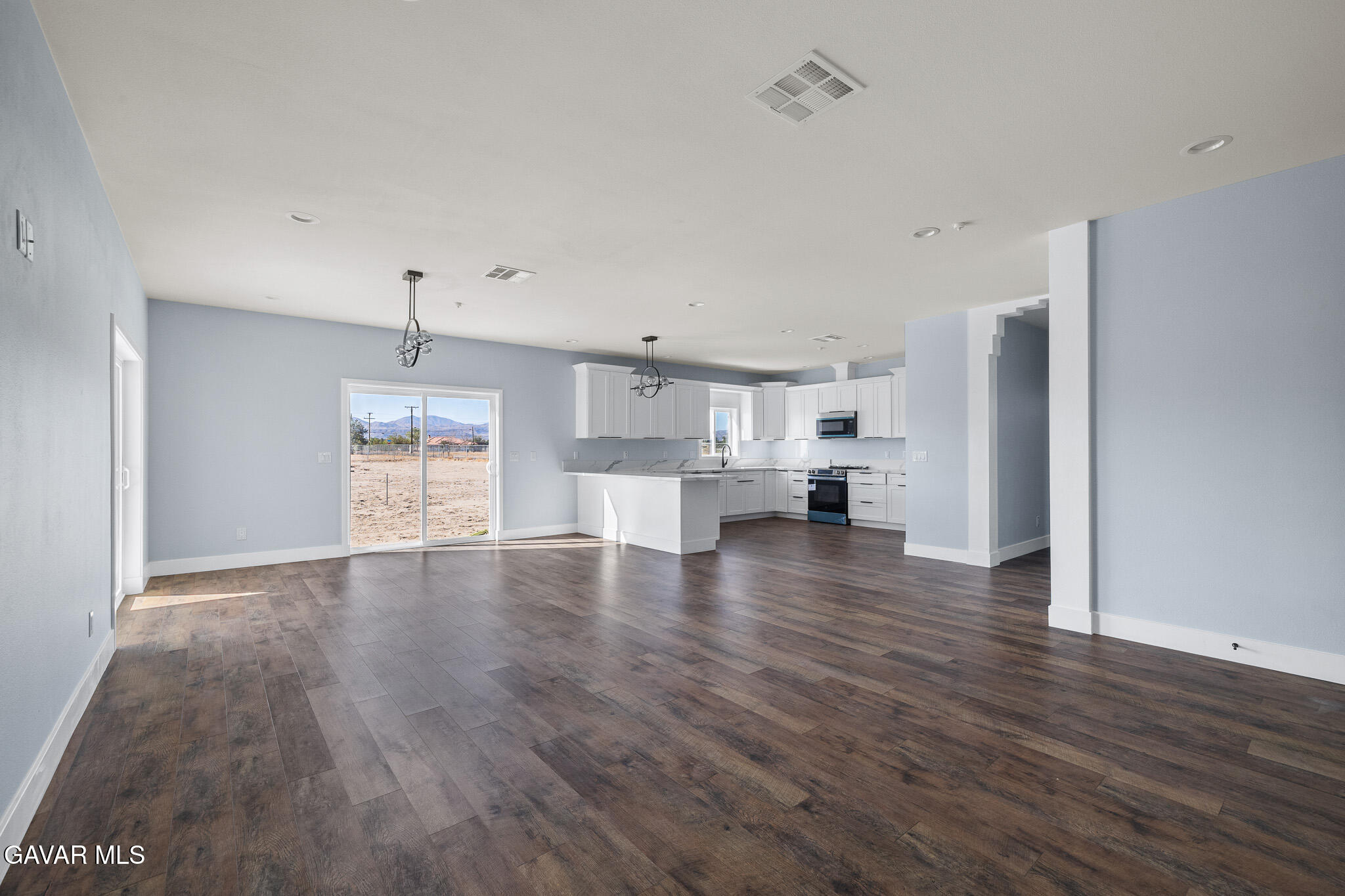 10708 East Ave R 14 Littlerock, CA 93543 - Photo 7 of 38 a view of kitchen with furniture and wooden floor