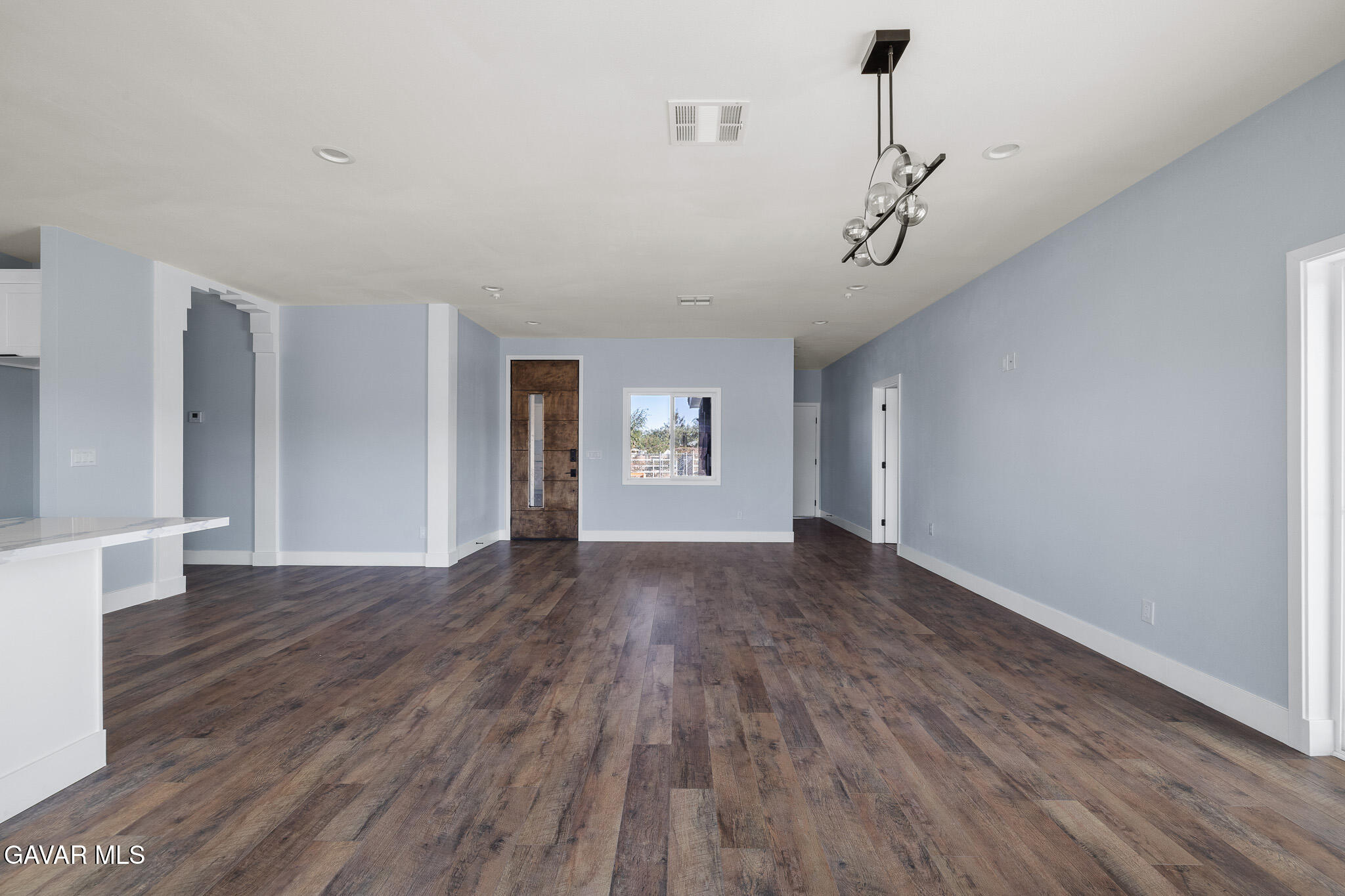 10708 East Ave R 14 Littlerock, CA 93543 - Photo 8 of 38 a view of empty room with wooden floor and ceiling fan