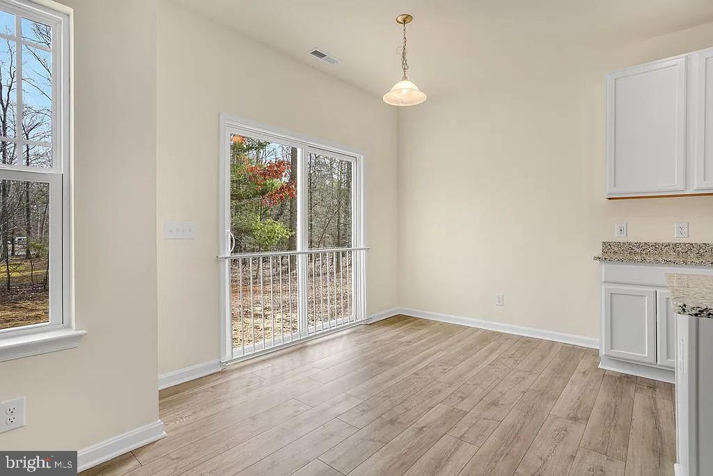 Tbd Tbd Harrier Way Waynesboro, PA 17268 - Photo 6 of 14 a view of an empty room with wooden floor and a window