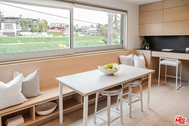 a room with a chair and a window