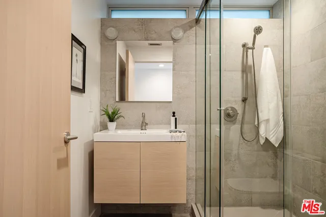 a bedroom with bed and a window