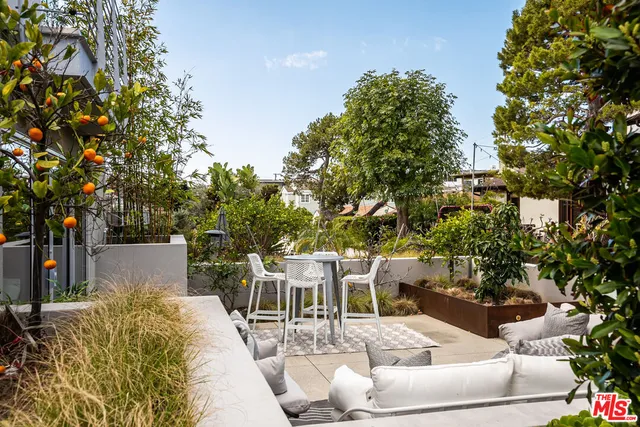 aerial view of a house with a yard