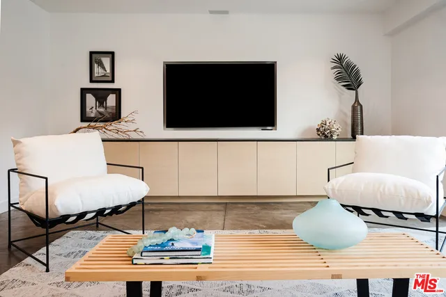 a kitchen with kitchen island a large window in it