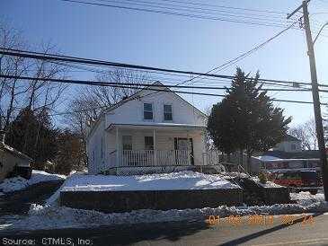 79 Main Street Griswold, CT 06351 - Photo 1 of 1 a front view of a house with garage
