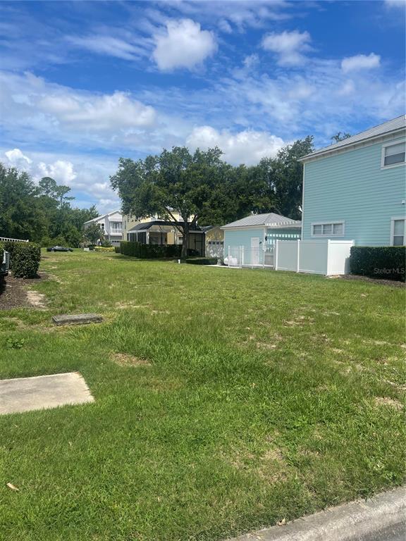 1550 Fairview Circle Reunion, FL 34747 - Photo 1 of 5 a view of yard with house and car parked