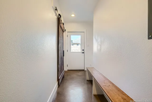 a close view of a sink a counter and cabinets in a room