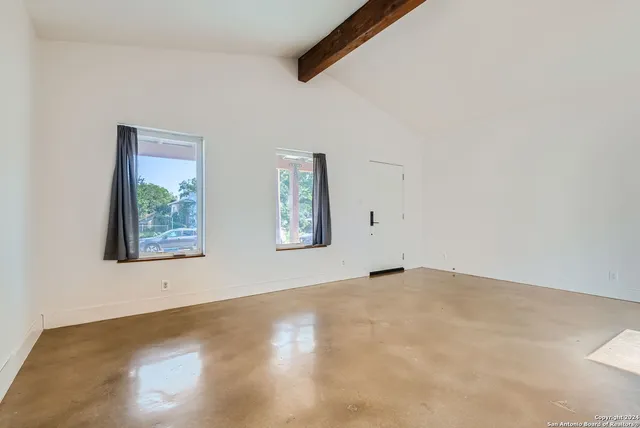 an empty room with windows