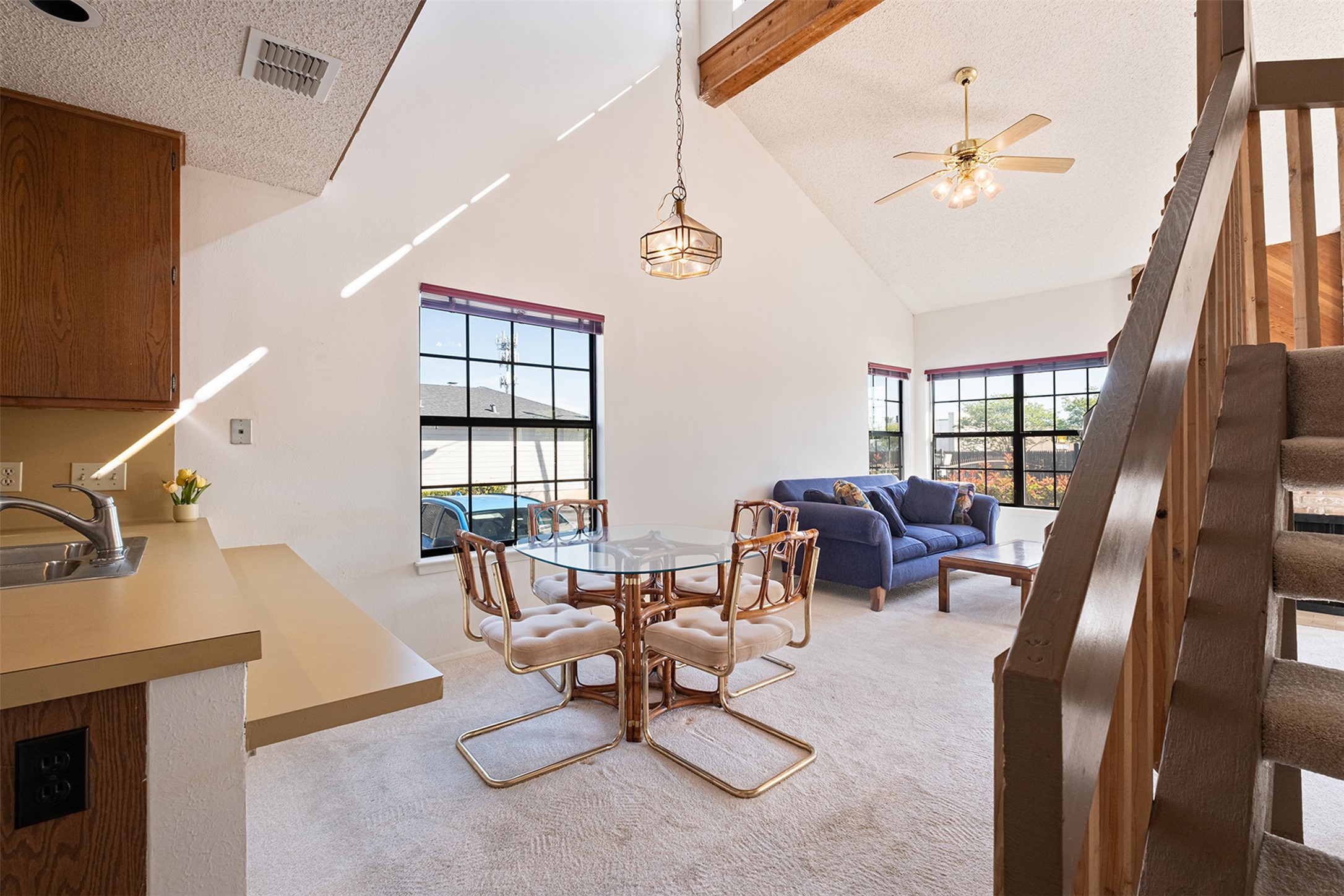 1748 Ohlen Road, Unit 16 Austin, TX 78757 - Photo 13 of 38 Dining area featuring light carpet and ceiling fan