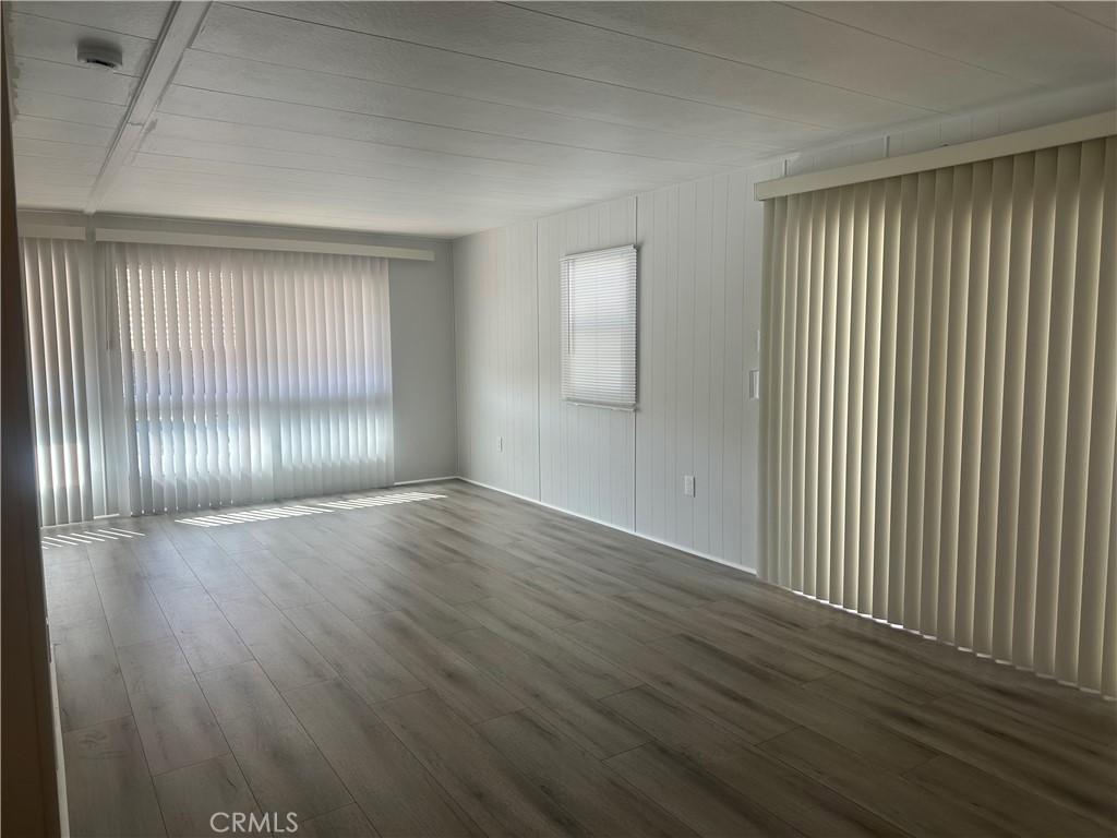3210-23 Santa Maria Santa Maria, CA 93455 - Photo 11 of 17 an empty room with wooden floor and windows