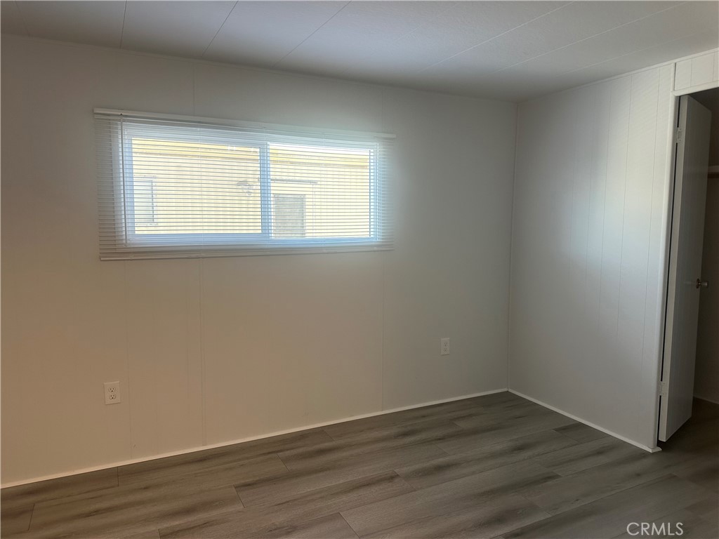 3210-23 Santa Maria Santa Maria, CA 93455 - Photo 13 of 17 a view of an empty room with wooden floor and a window