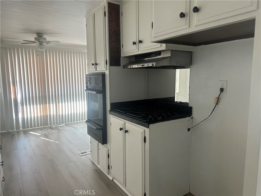 3210-23 Santa Maria Santa Maria, CA 93455 - Photo 6 of 17 a kitchen with a refrigerator and a stove