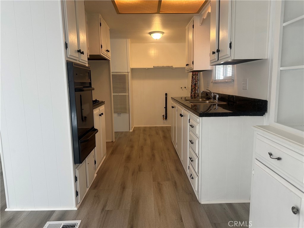 3210-23 Santa Maria Santa Maria, CA 93455 - Photo 7 of 17 a kitchen with stainless steel appliances a sink and a refrigerator