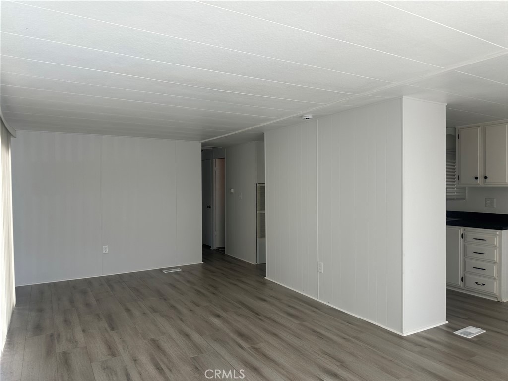 3210-23 Santa Maria Santa Maria, CA 93455 - Photo 10 of 17 a view of an empty room with wooden floor and closet