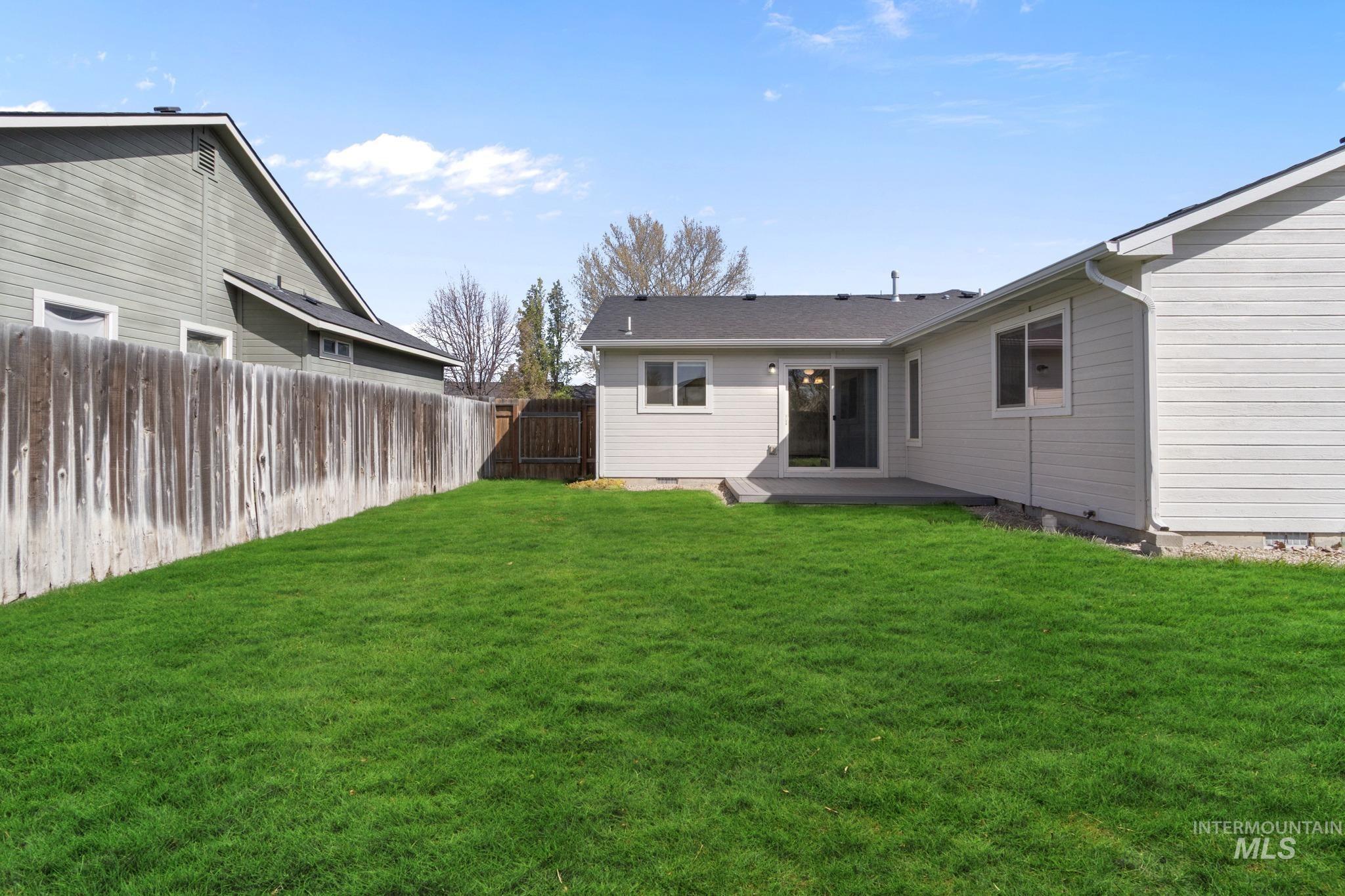 4822 Charme Street Caldwell, ID 83607 - Photo 20 of 22 Back of property featuring crawl space and a fenced backyard