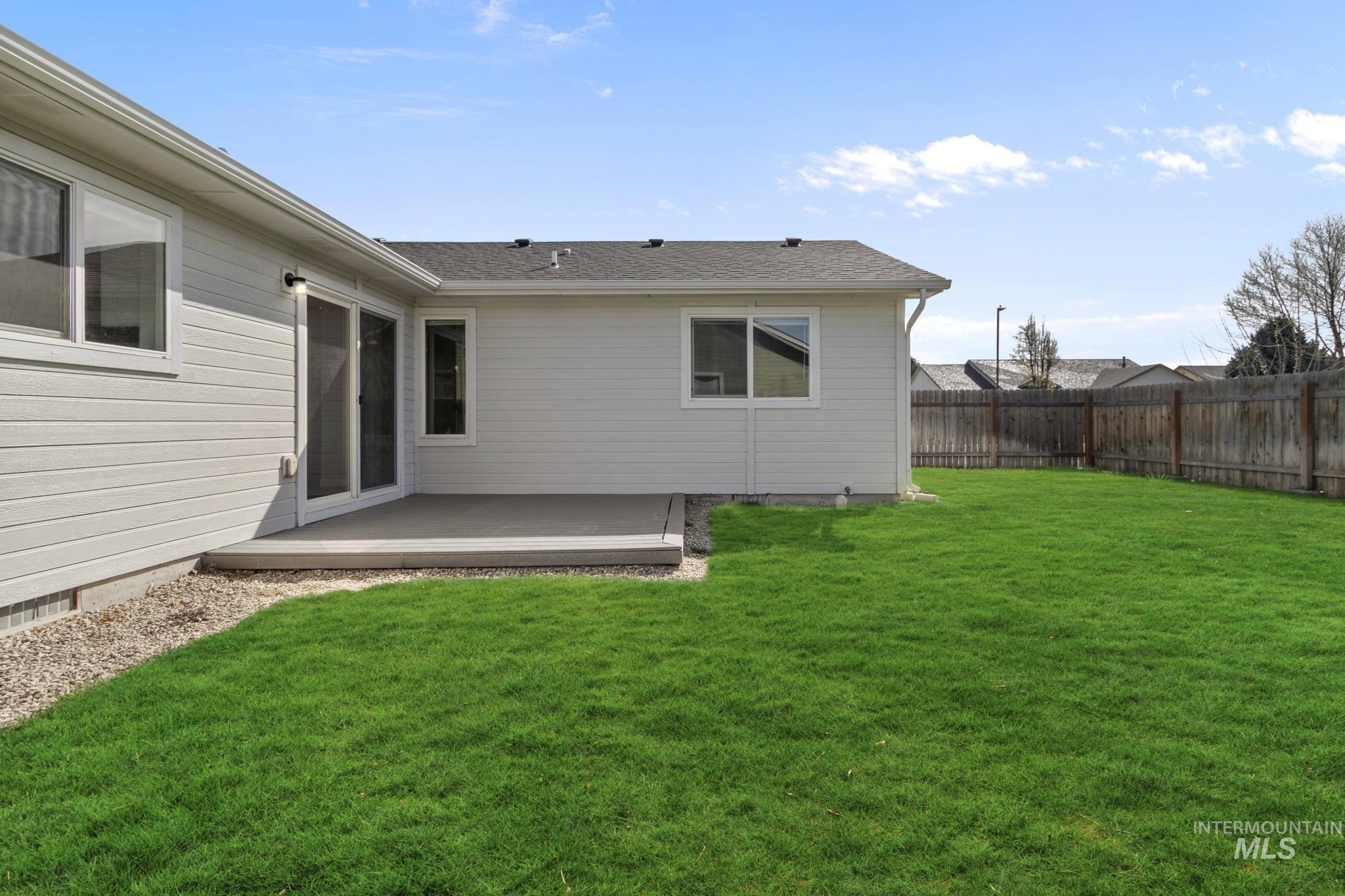 4822 Charme Street Caldwell, ID 83607 - Photo 21 of 22 Fenced backyard featuring a deck