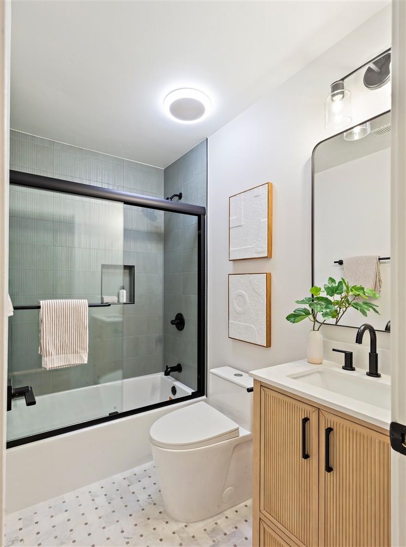 2973 Ralston Way Hayward, CA 94541 - Photo 36 of 55 Full bathroom with vanity, shower / bath combination with glass door, and light flooring