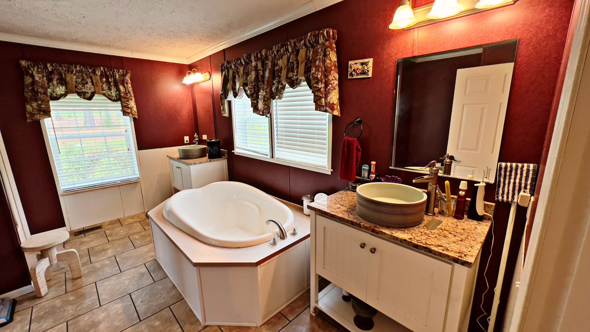 4027 Forrest Hill Road Bolivar, TN 38008 - Photo 15 of 32 a bathroom with a sink a toilet and mirror