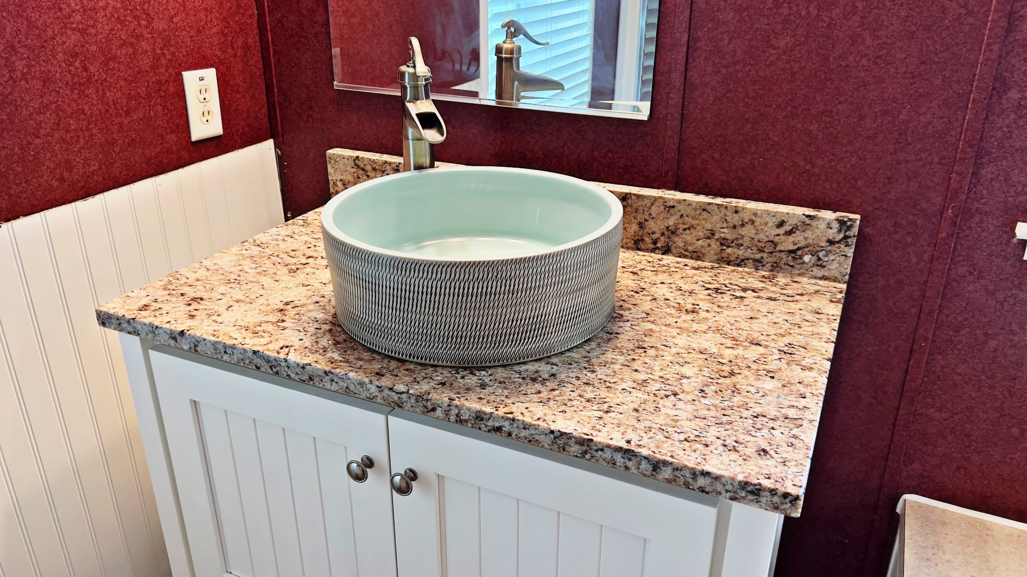 4027 Forrest Hill Road Bolivar, TN 38008 - Photo 17 of 32 a bathroom with a granite countertop sink and mirror
