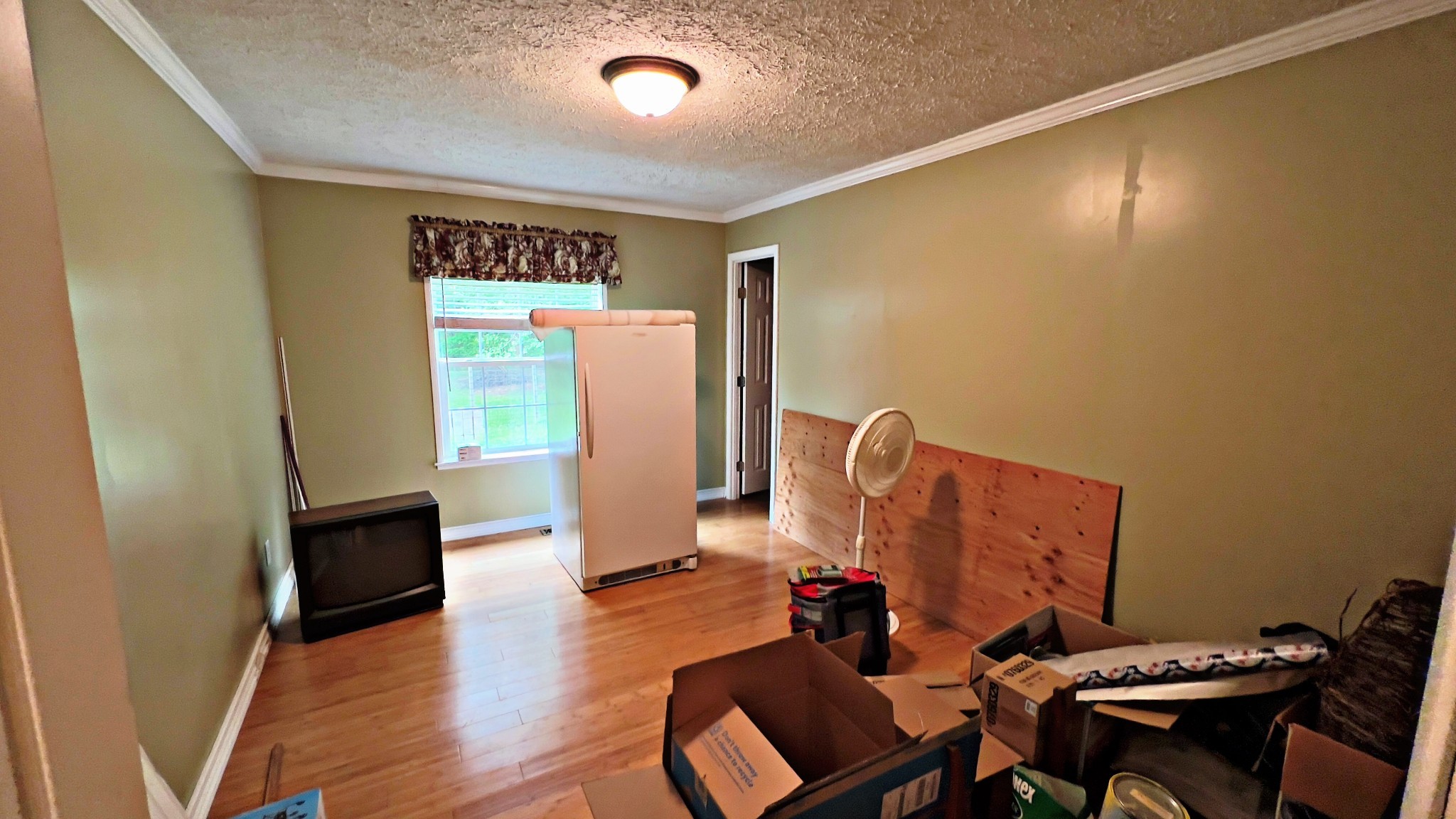 4027 Forrest Hill Road Bolivar, TN 38008 - Photo 21 of 32 a view of a workspace with furniture and wooden floor