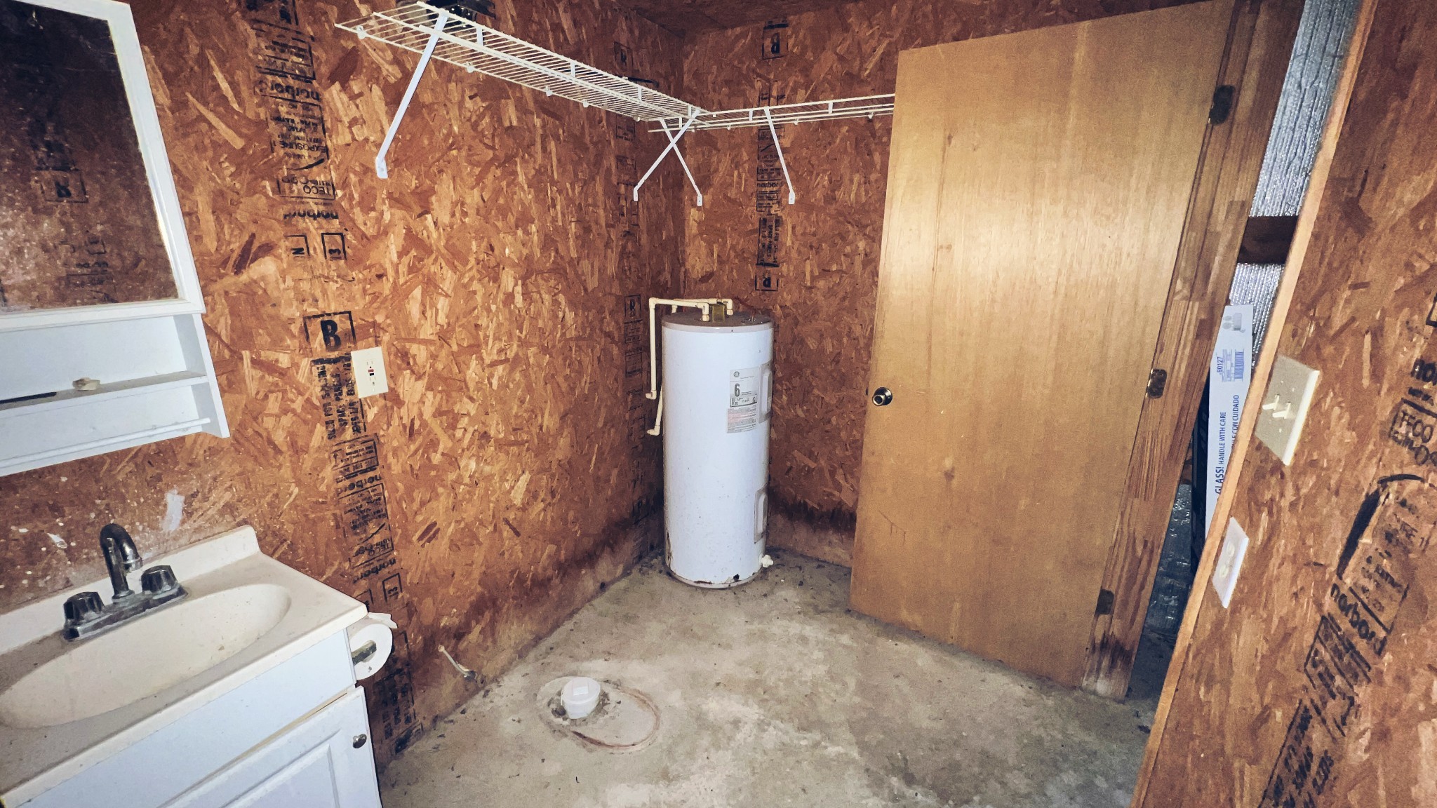 4027 Forrest Hill Road Bolivar, TN 38008 - Photo 30 of 32 a bathroom with a sink and mirror