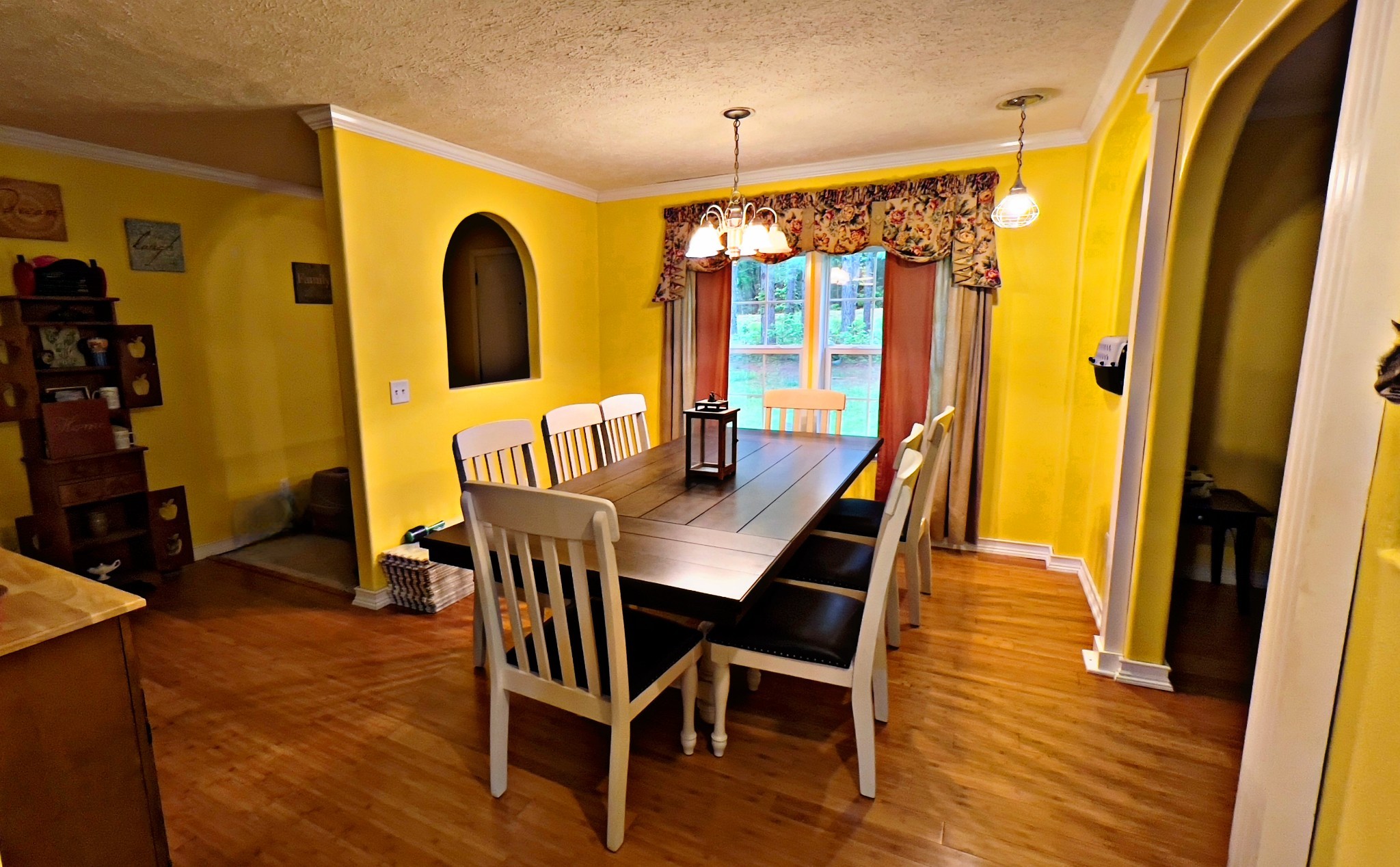 4027 Forrest Hill Road Bolivar, TN 38008 - Photo 9 of 32 a view of a dining room with furniture and wooden floor