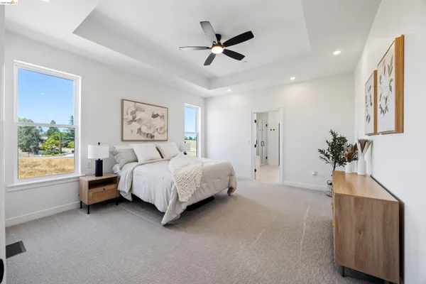 a bedroom with a bed and a couch