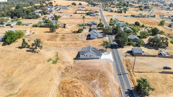 an aerial view of houses with yard