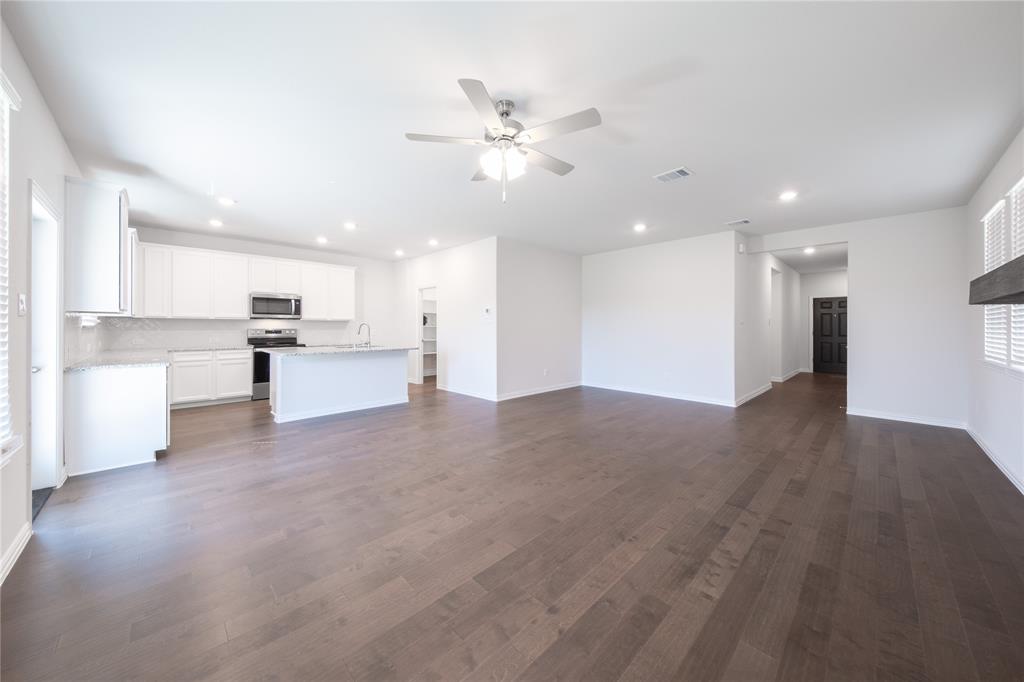 2613 Spade Street Anna, TX 75409 - Photo 10 of 38 a view of a kitchen with a sink and wooden floor