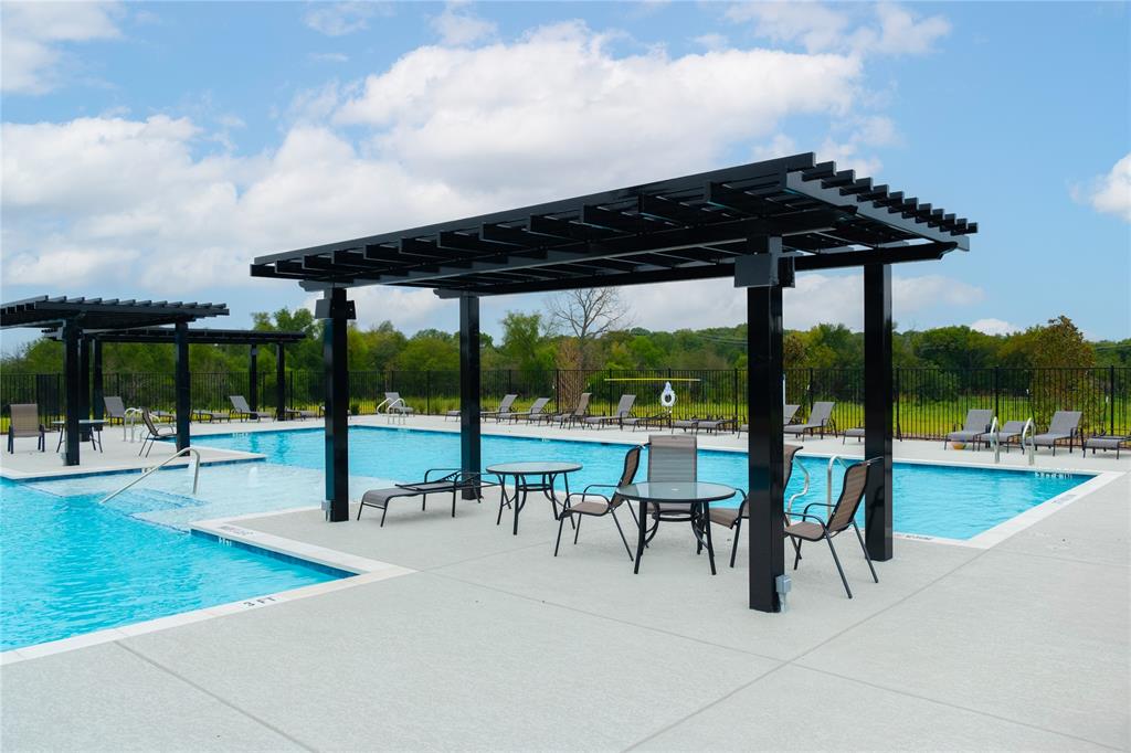 2613 Spade Street Anna, TX 75409 - Photo 33 of 38 a view of a chairs and table in patio with a swimming pool
