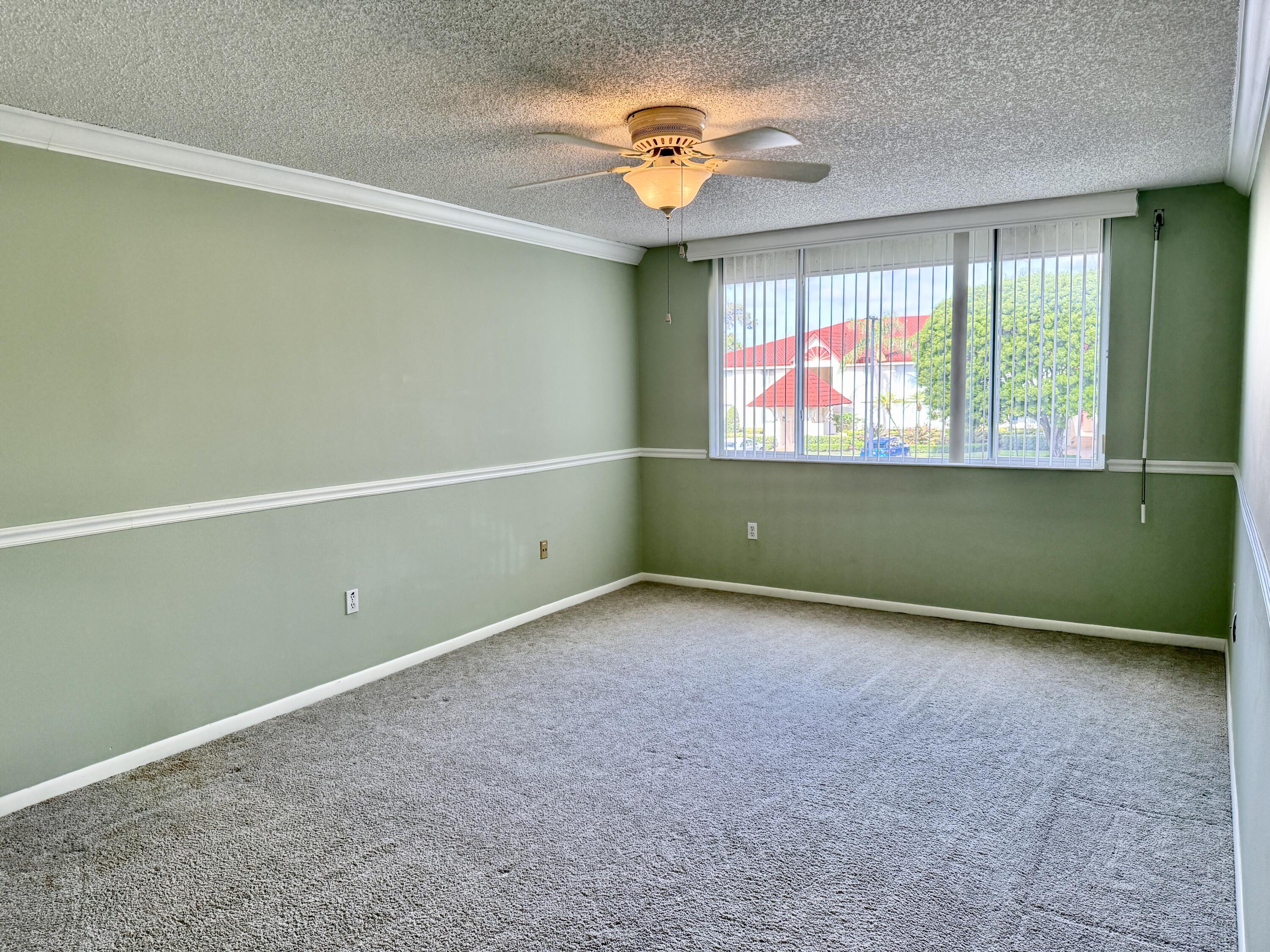 104 Half Moon Circle, Unit B2 Hypoluxo, FL 33462 - Photo 12 of 26 PRIMARY BEDROOM