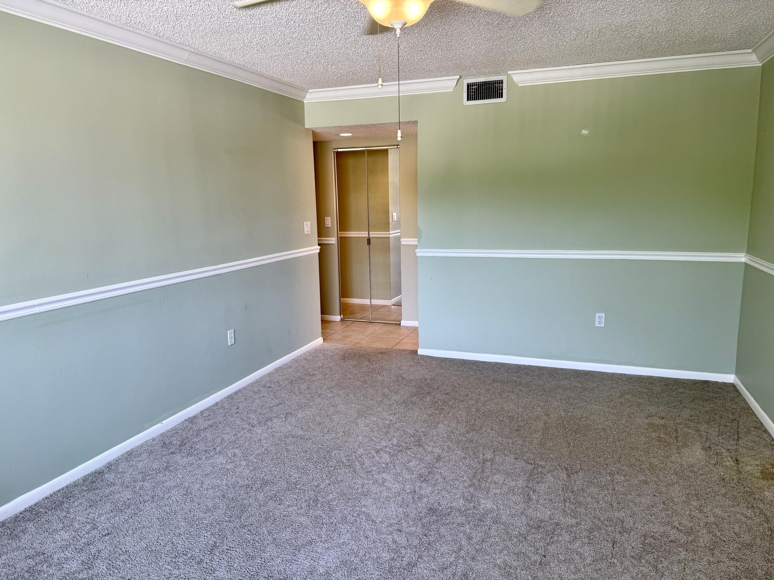 104 Half Moon Circle, Unit B2 Hypoluxo, FL 33462 - Photo 13 of 26 PRIMARY BEDROOM